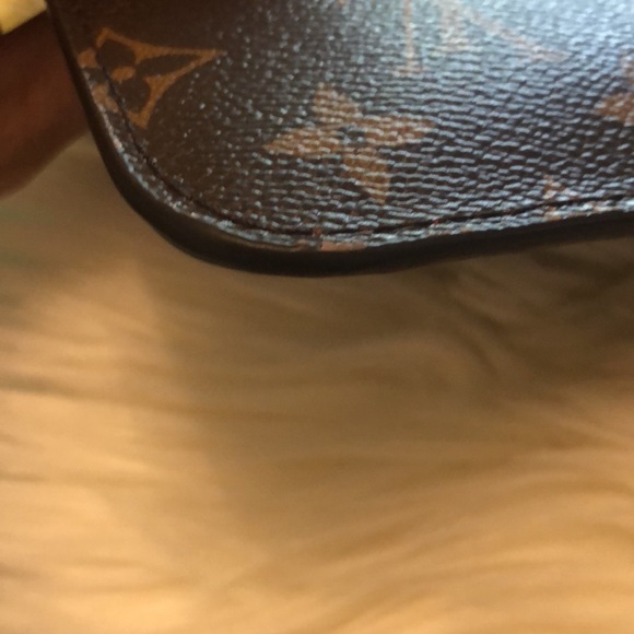 LV wristlet from World Tour collection. Authentic